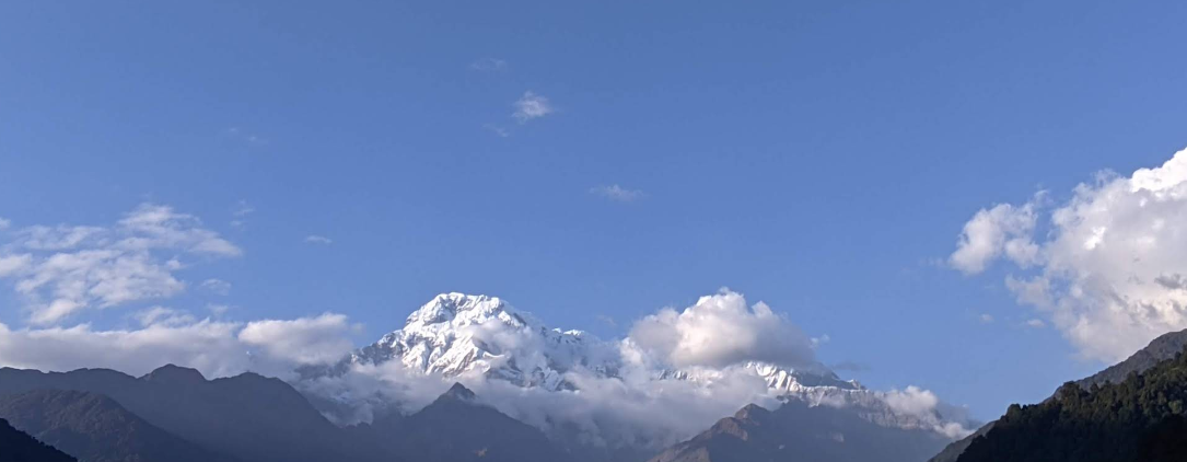 Annapurna South rising above the clouds over Landruk